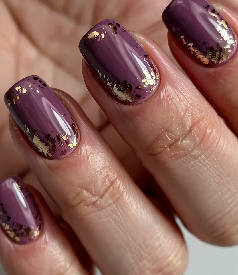 winter acrylic nails plum luxe with gold foil