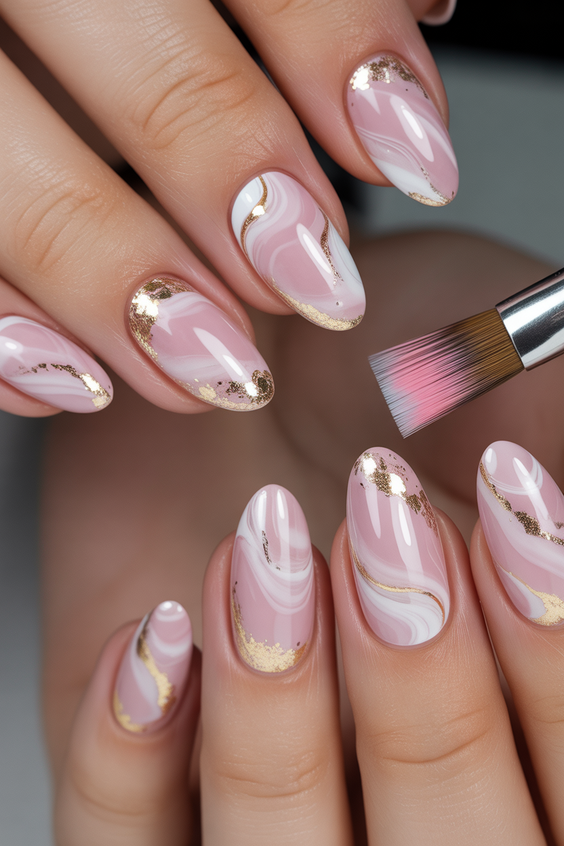 almond nail designs 2026 Milky Pink Almond Nails with Gold Marble