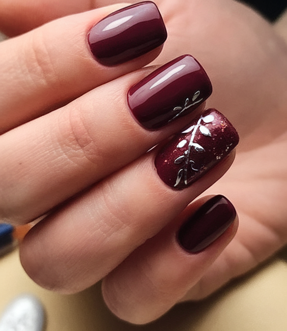 brown nails design Glossy Burgundy With Delicate Botanical Detail