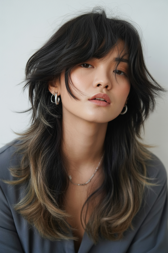 edgy wolf cut hairstyle 2026 shadow root wolf cut with cascading two tone layers