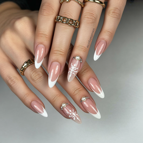 French nail designs 2026 Almond French with pearl snowflake art