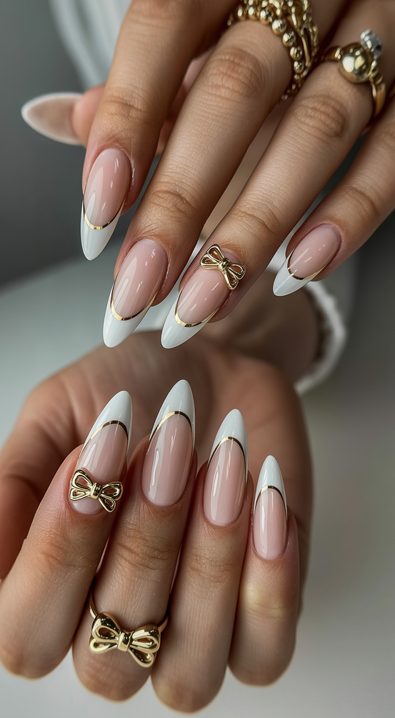 French nail designs 2026 almond French with gold bow details