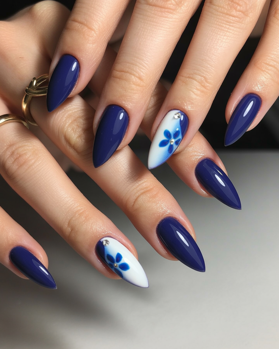 nails design ideas 2026 Deep Blue Almond With Floral Accent