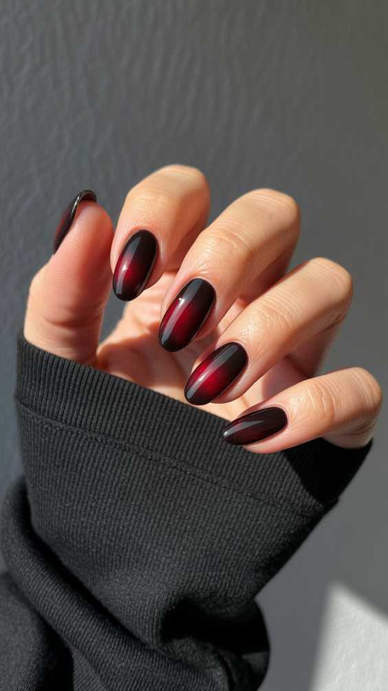 trendy cat eye nails 2026 Dark Red Magnetic Depth With a Glossy Finish