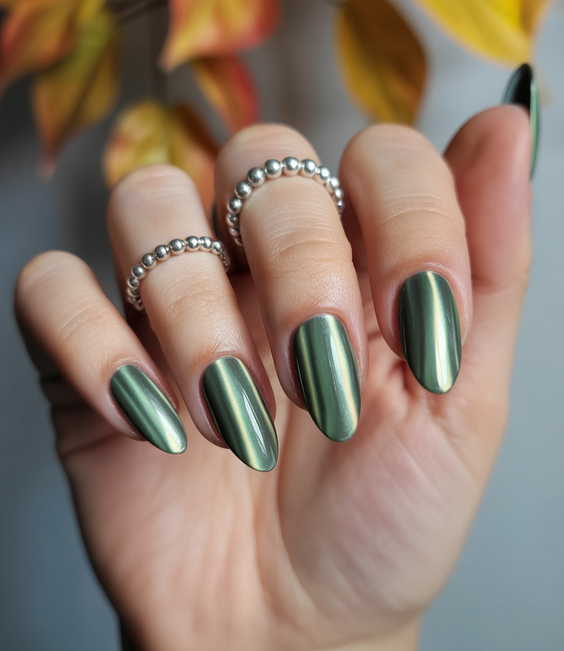 trendy cat eye nails 2026 Muted Green Cat Eye Nails With a Clean Silhouette