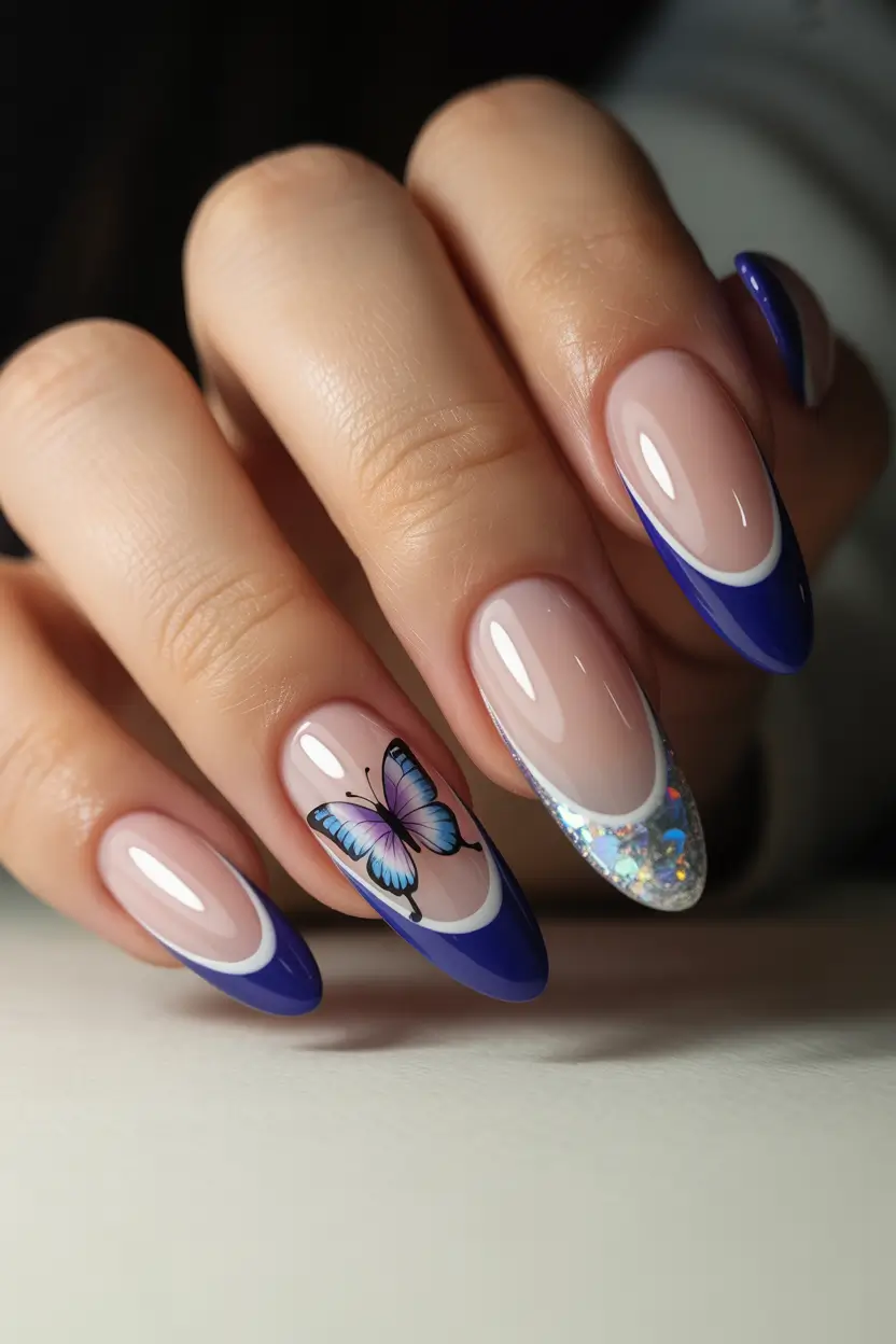 chic classy spring nails 2026 deep blue almond french with butterfly accent 16