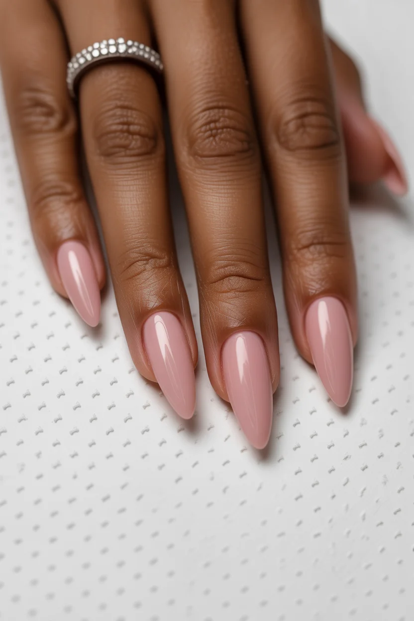 cute spring nails for dark skin 2026 Glossy Blush Pink Almond for Timeless Elegance 18
