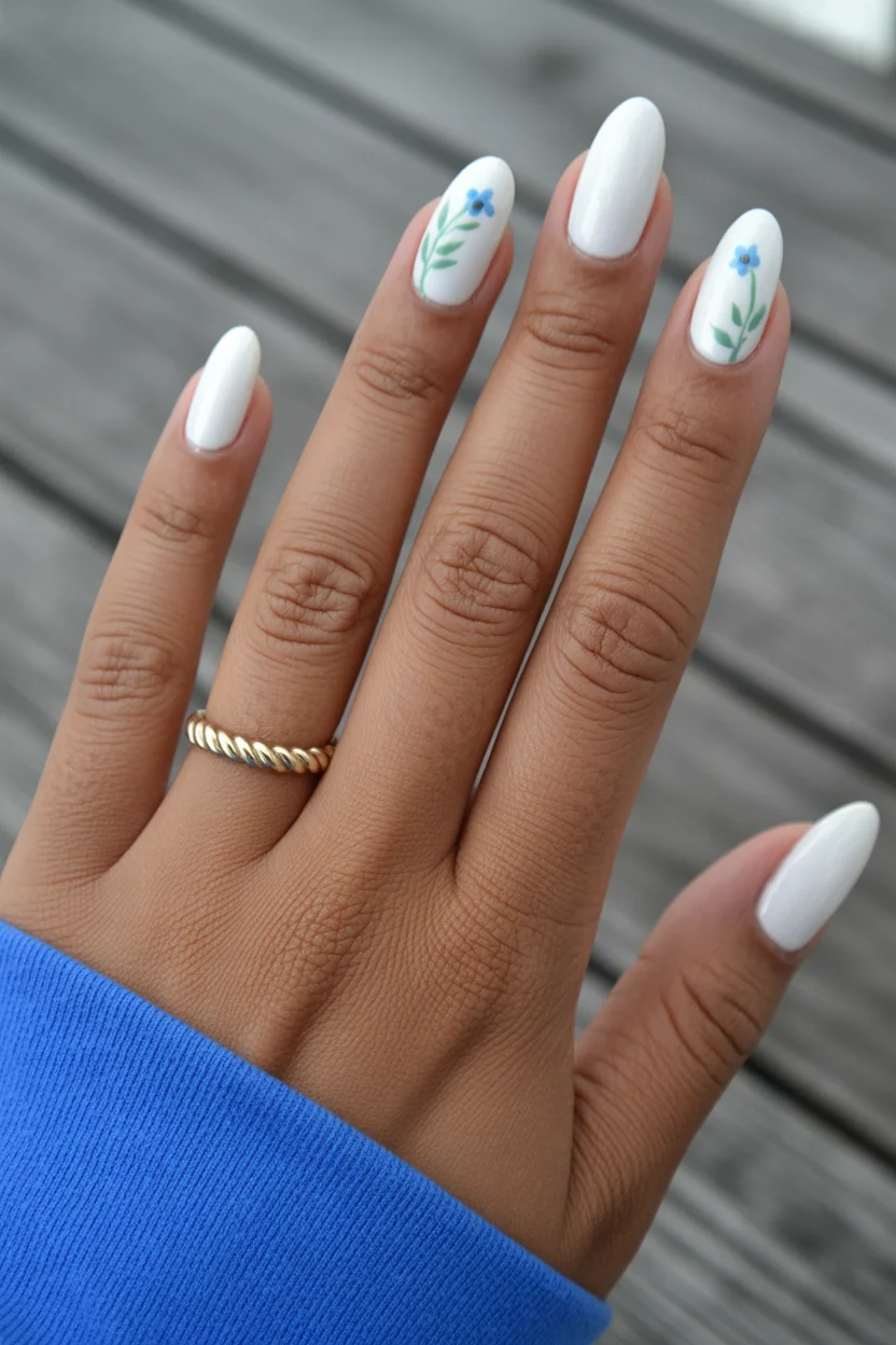 cute spring oval nails 2026 milky white with blue flowers