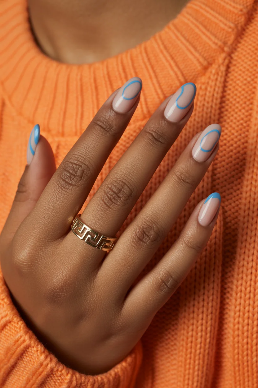 stylish spring nails for brown skin 2026 Minimal Nude with Sky Blue Line Art