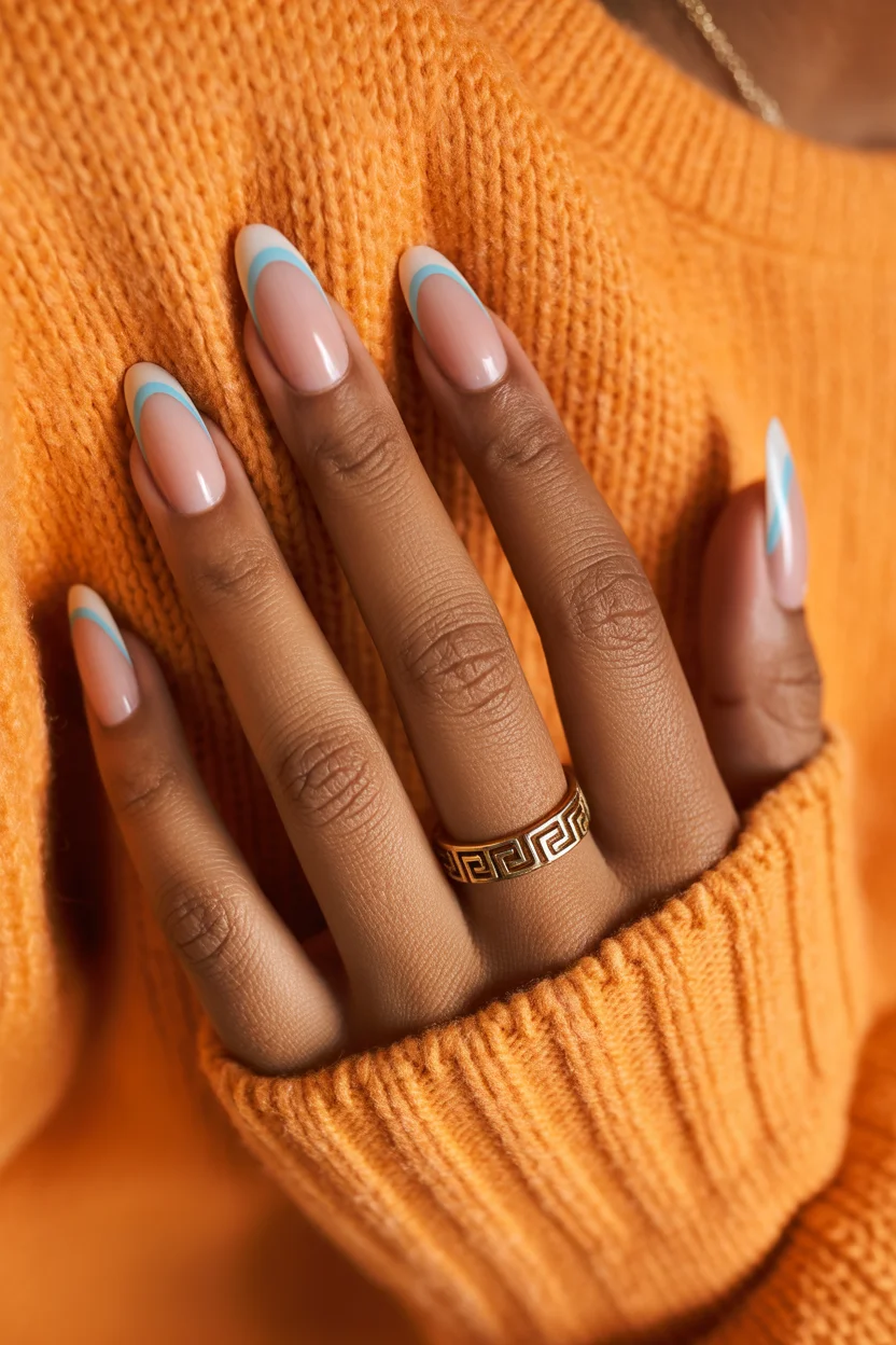 stylish spring nails for tan skin 2026 Soft Nude Almond with Icy Blue Micro-French