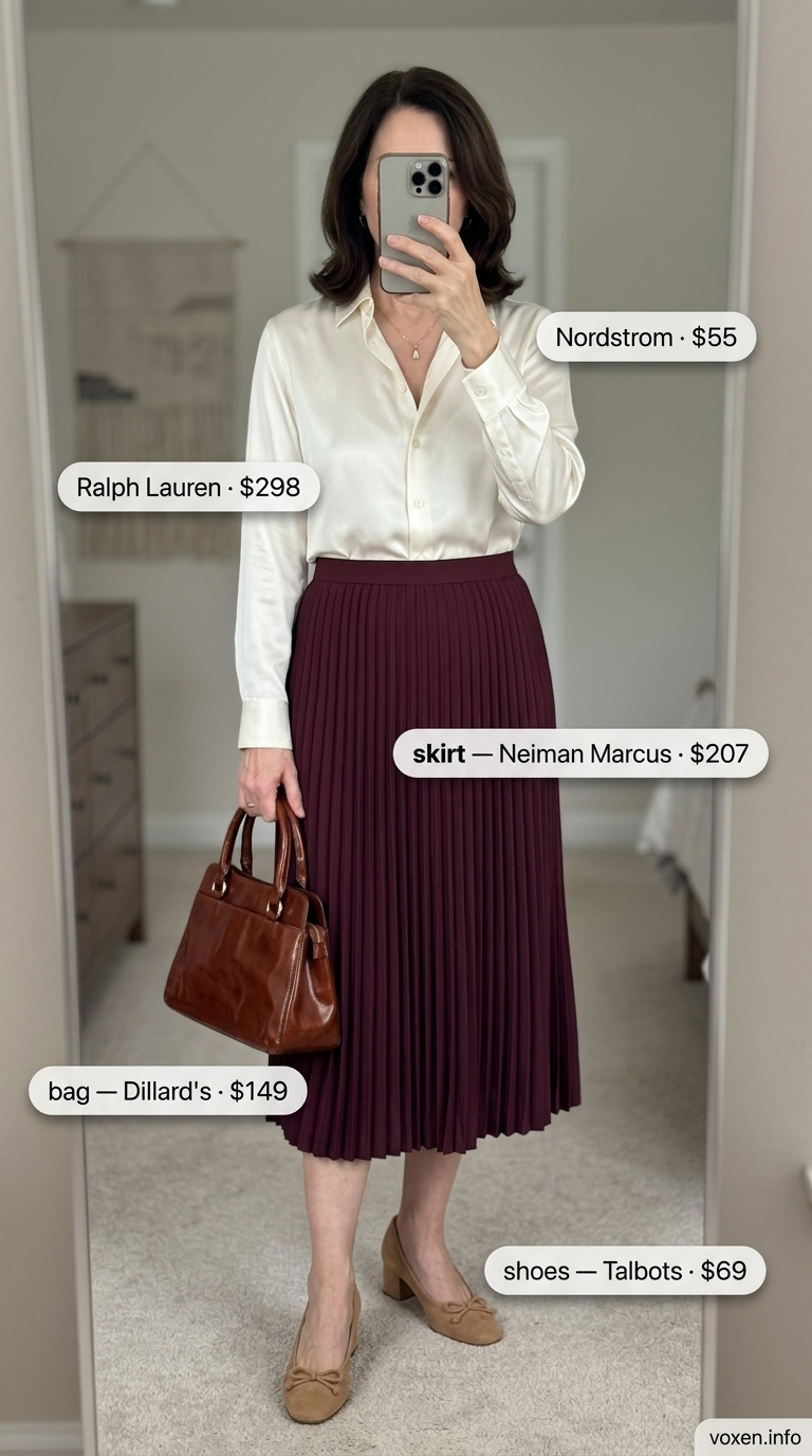 Elegant summer outfit for women over 60 2026: Burgundy midi skirt, ivory silk blouse, and nude heels.