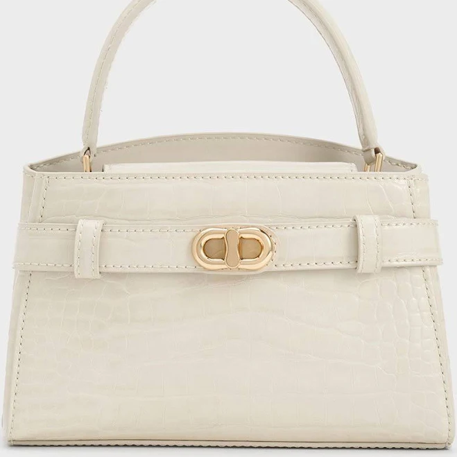 bag Charles & Keith Aubrielle Croc-effect Belted Top Handle Bag charleskeith.com $96