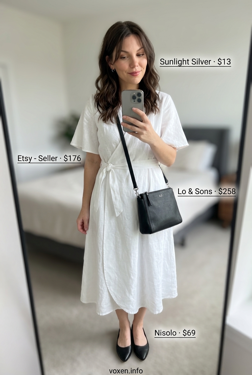 Crisp white linen midi wrap dress for modern minimalist summer style. Chic with black flats and crossbody.