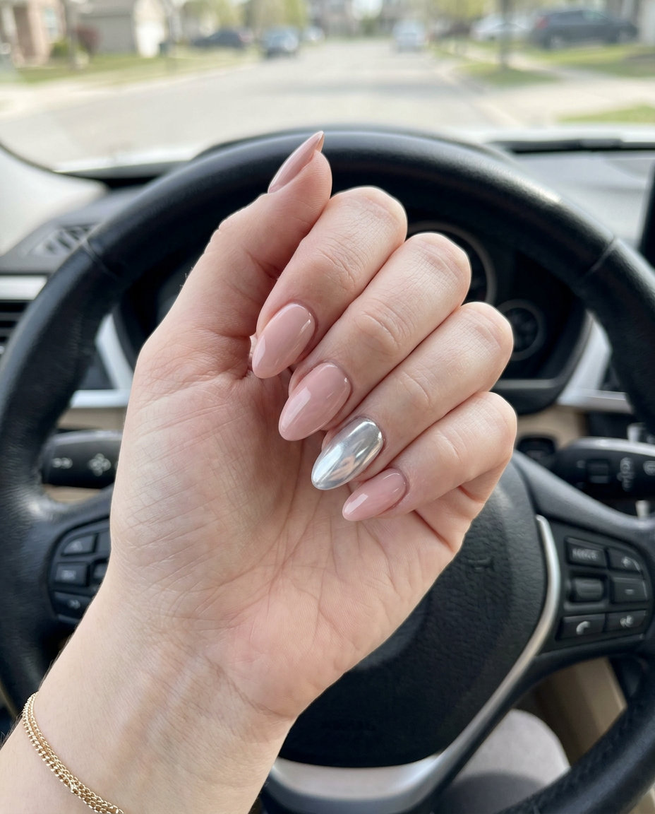 Silver chrome accent almond nails with soft pink for fair skin. Almond summer nails 2026.