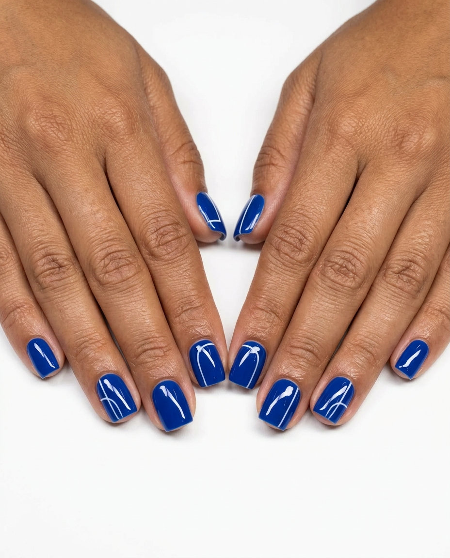 Chic cobalt blue and white graphic line nails for daily wear and summer brunch. Colourful summer nails 2026.