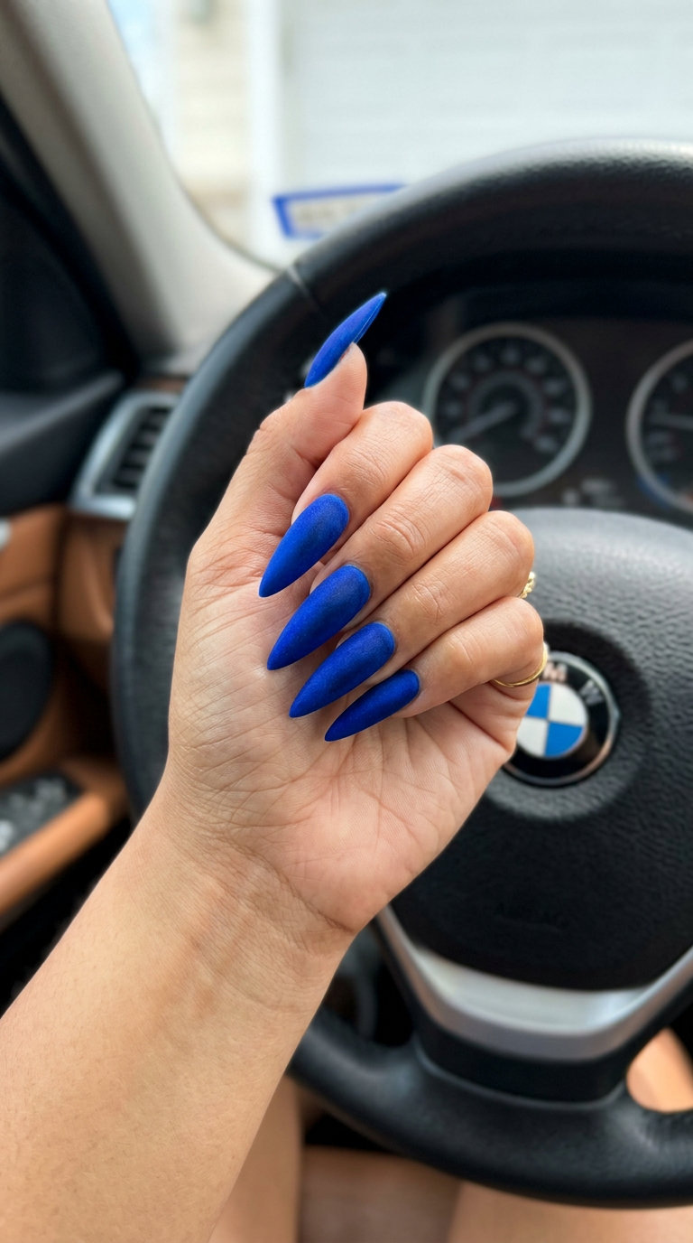 Electric blue velvet stiletto nails for sultry and glamorous colourful summer nails 2026.