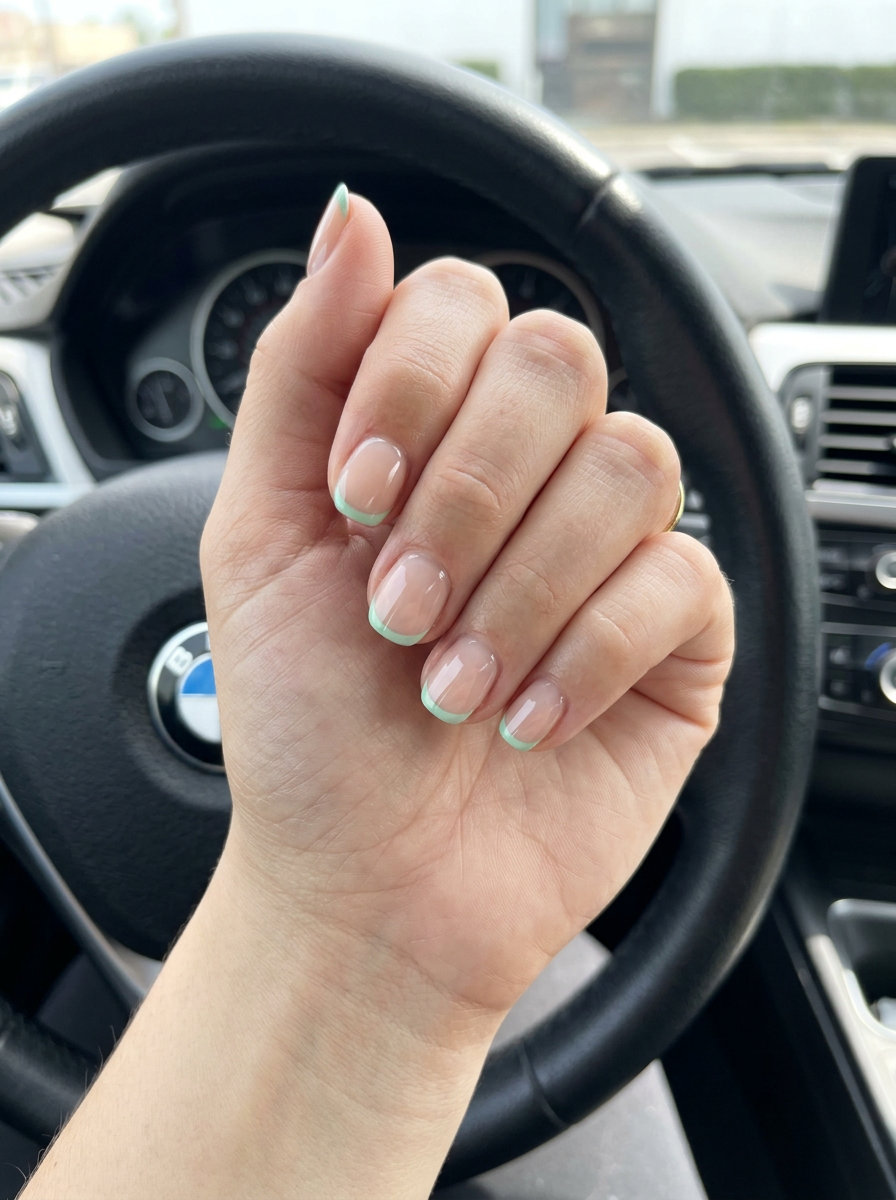 Mint Green Micro French Manicure Summer 2026 Mint green micro French manicure summer 2026 on short round nails for a clean-girl everyday look.