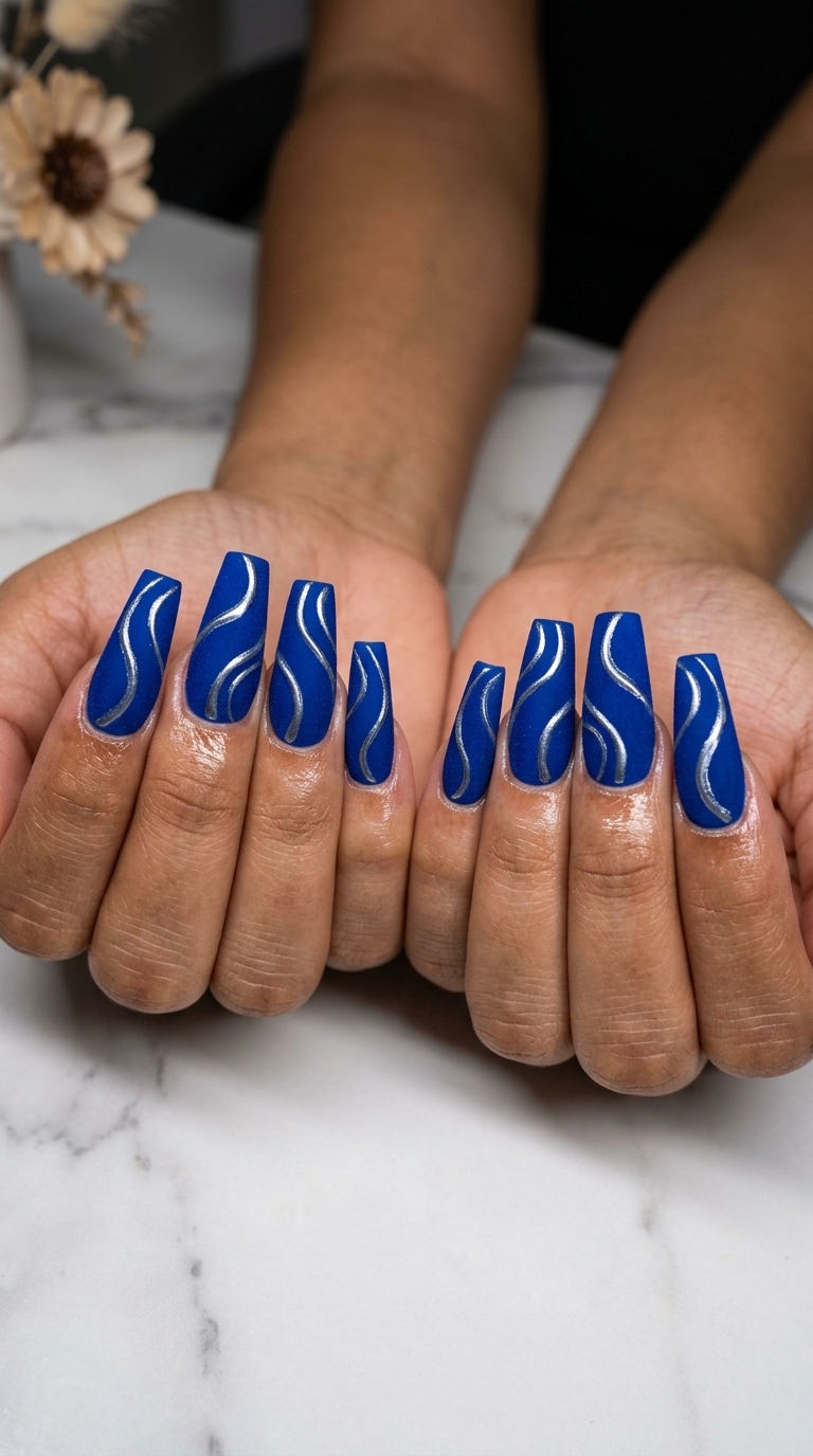 Cobalt Velvet Swirl Nails 2026 Cobalt blue velvet nails with glossy swirls for evening events. Fun summer nails 2026.