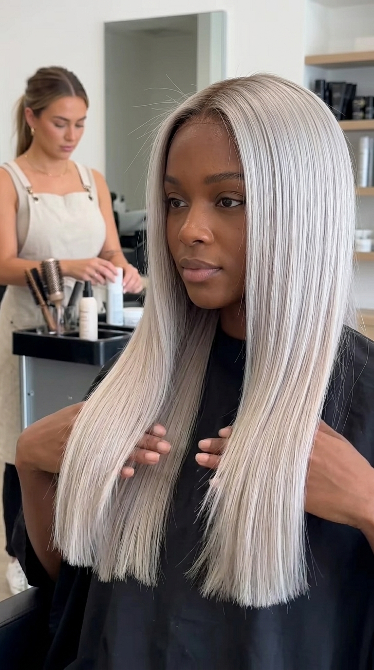 long blunt haircut with icy ash blonde and silver undertones, dark vanilla root shadow for sophistication