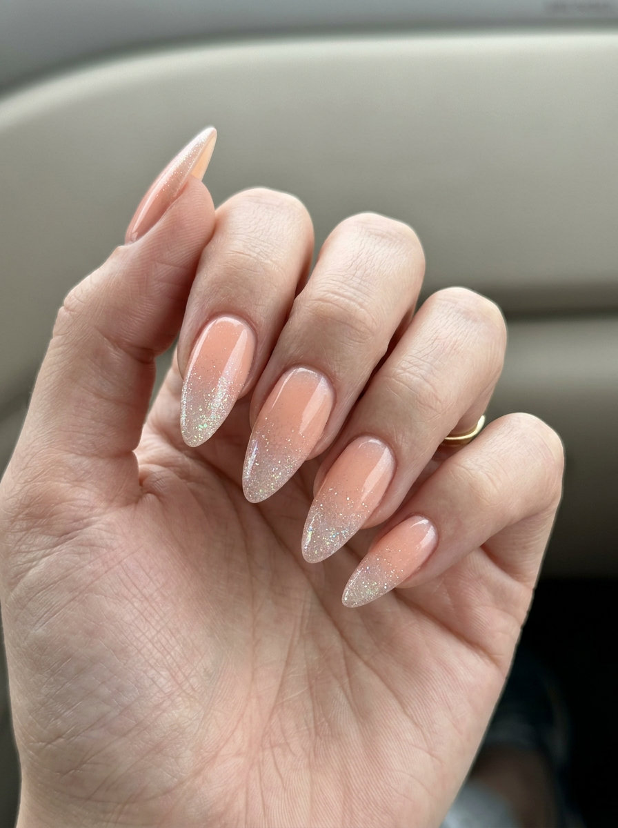 Long Summer Nails 2026: Glam Peach Gradient Long summer nails 2026: Peach fuzz glitter gradient coffin shape for parties.