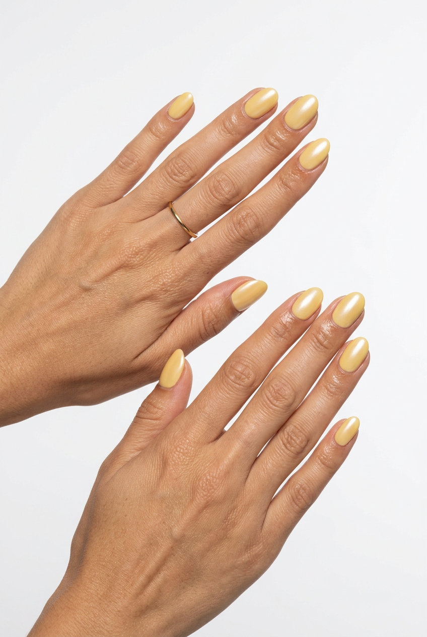Butter Yellow Chrome Oval Summer Nails 2026 Butter Yellow Subtle Chrome oval summer nails 2026 for all skin tones, ideal for festivals and casual days.