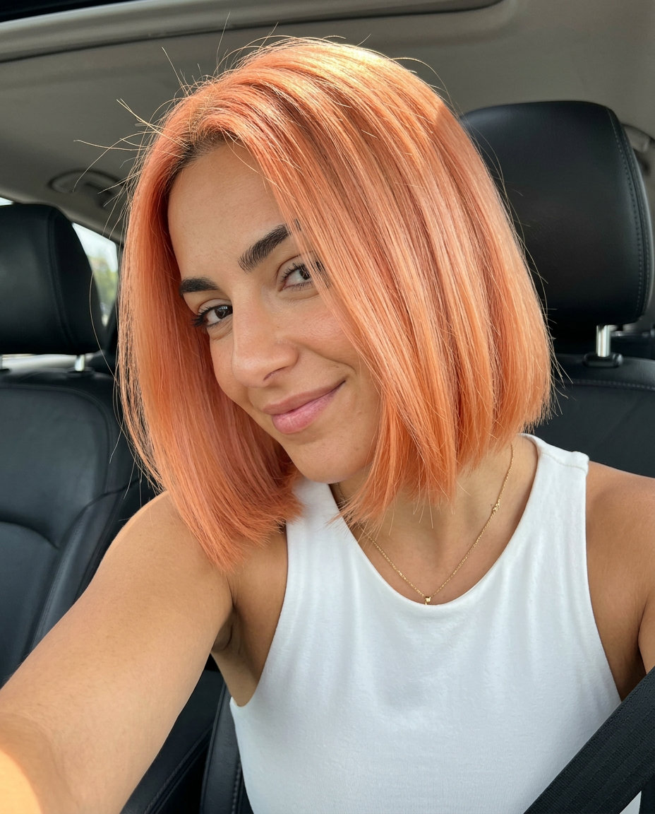 medium-short peach to apricot ombre bob with blunt perimeter and diffused ends