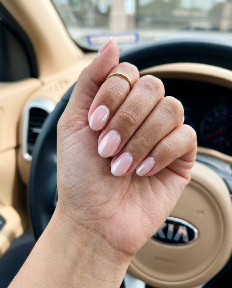 Short Oval Summer Nails 2026: Pink Glazed Donut Short oval summer nails 2026: Pink Glazed Donut sheer iridescent nails for a clean-girl, romantic vibe.