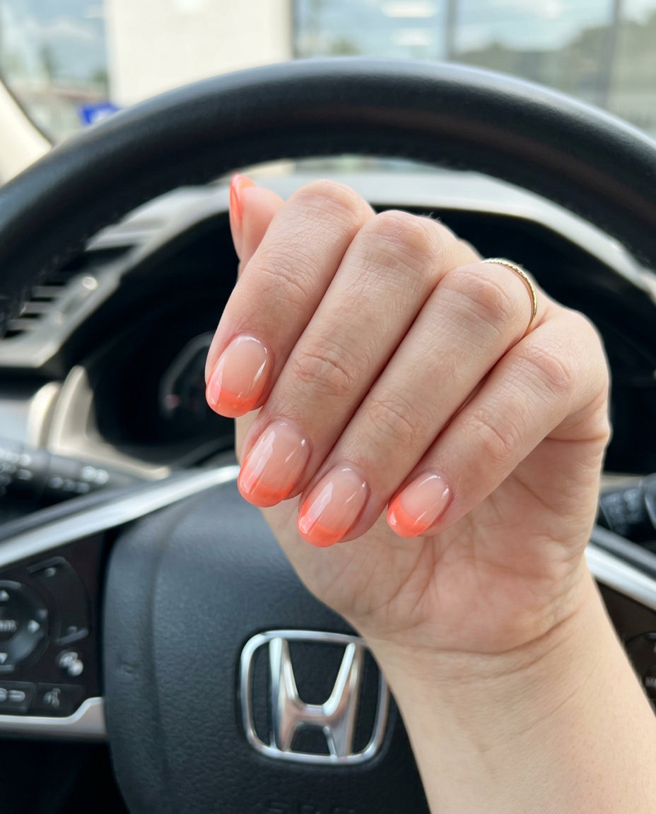Short round summer nails 2026: Peach jelly French tips. Juicy & vibrant for vacations.