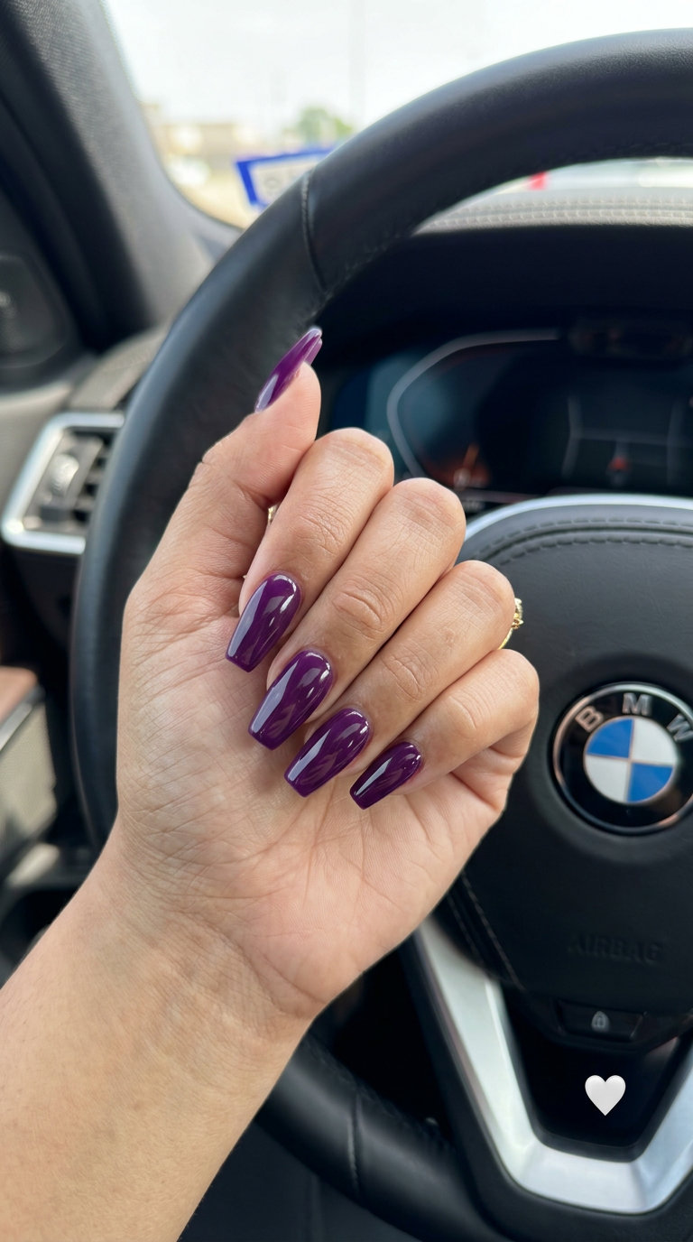 Solid Summer Nails 2026: Jewel Tone Coffin Gloss Glamorous deep purple jewel tone coffin nails for a luxurious solid summer nails 2026 look. Perfect for parties and date nights.
