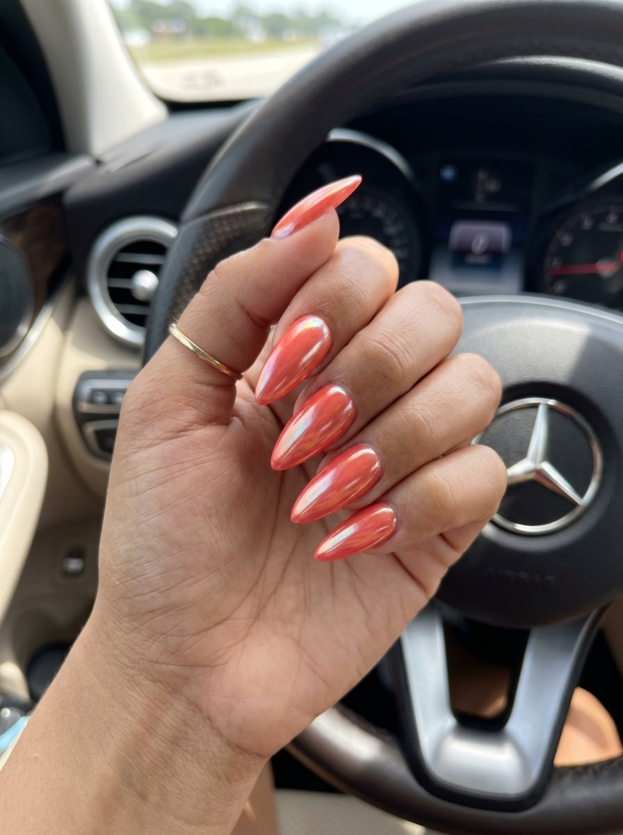 Vivid Coral Glossy Stiletto Nails 2026 | Tropical Vacation Style Vivid coral glossy stiletto nails for vacations and summer parties in 2026. Sultry and vibrant.