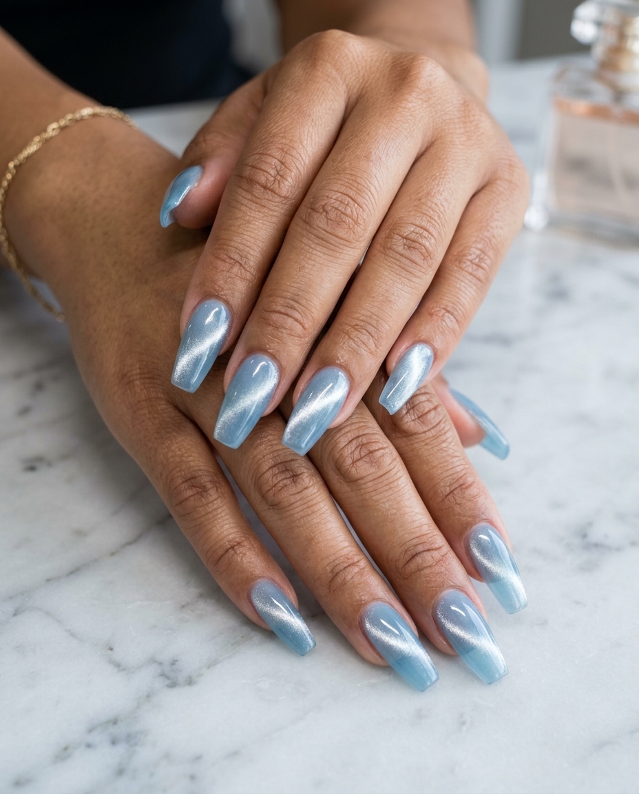 Summer Classy Nails 2026: Captivating Light Blue Jelly Light Blue Jelly Cat-Eye: Summer classy nails 2026, futuristic and captivating for parties or festivals.