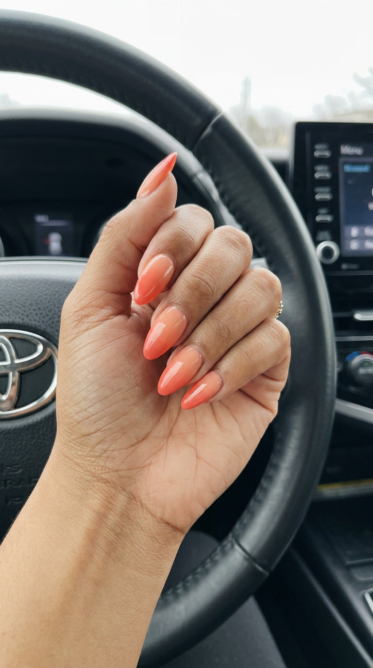 Coral Sunset Ombre Gradient, a vibrant summer manicure color 2026 for vacations and beach parties. Coral to peach blend.