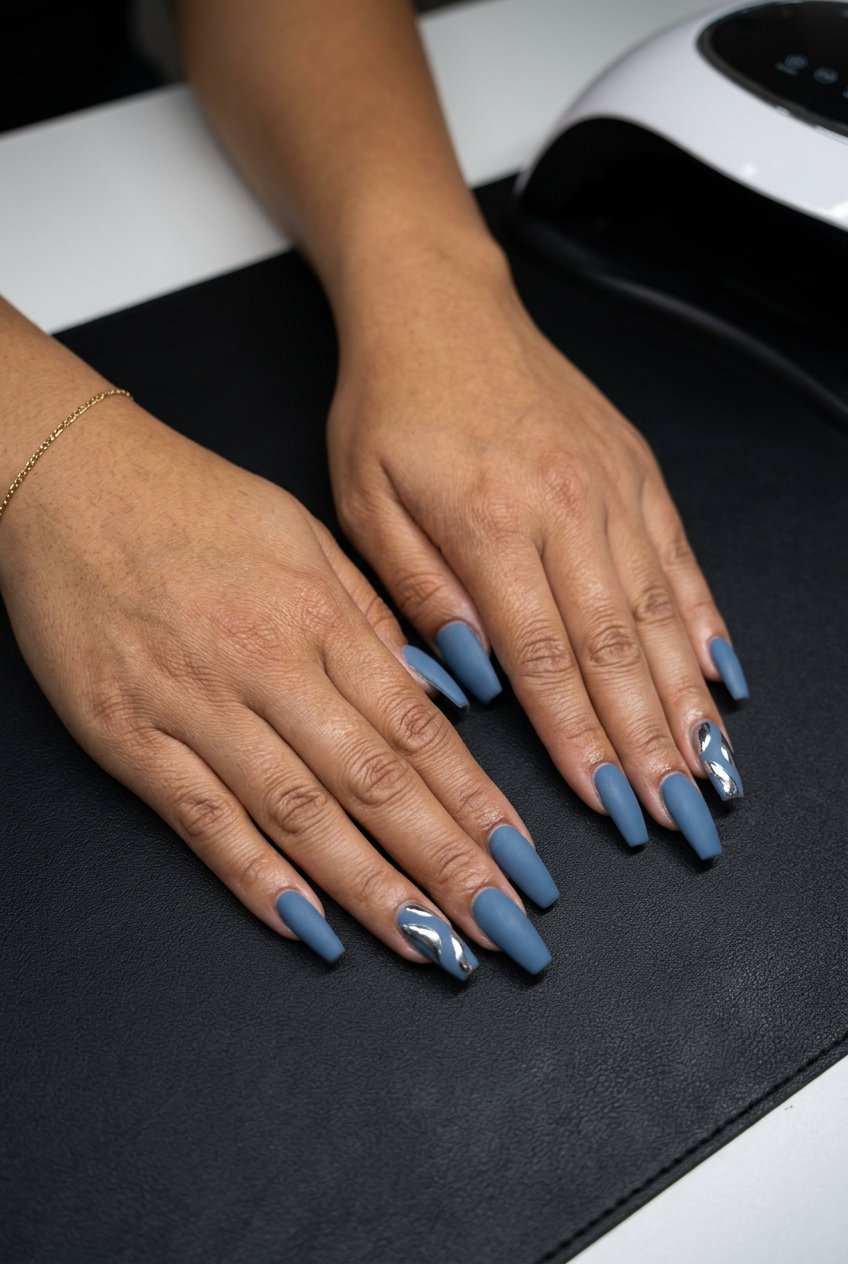 Industrial Denim Chrome Nails 2026 Dusty denim blue with silver chrome accents, an edgy summer nail manicure idea 2026.