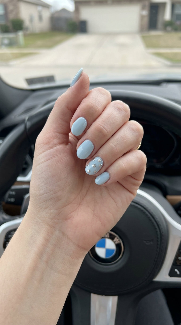 Icy Blue Chrome Accents nails for pale skin 2026: opaque icy blue with silver chrome dots. Party, modern aesthetic.