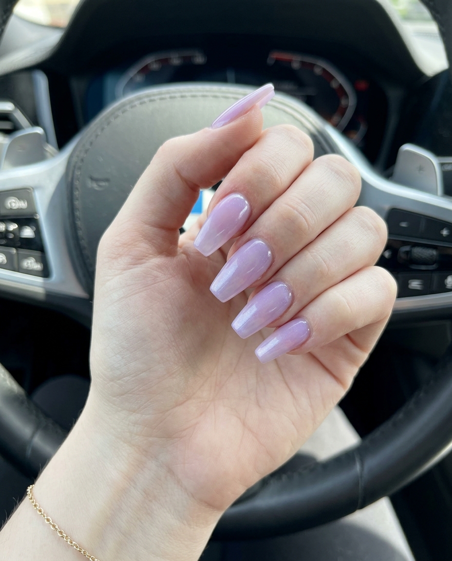 Sheer lavender gradient nails on long stiletto shape, ethereal summer nails for pale skin 2026.