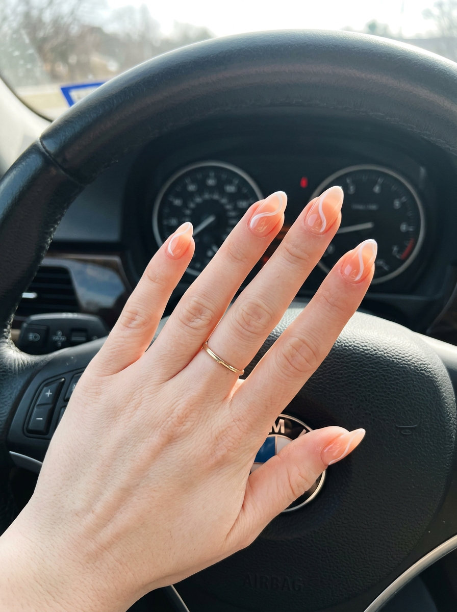 Sheer peach jelly swirl nails for summer 2026, playful for vacations and casual outings. Sweet and luminous with white swirls.