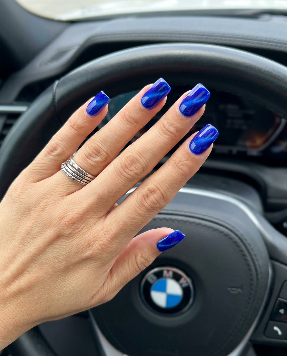 Electric Blue Cat-Eye Nails 2026: Futuristic Glam Electric blue cat-eye square nails for summer vibes nails 2026, perfect for nights out and concerts.