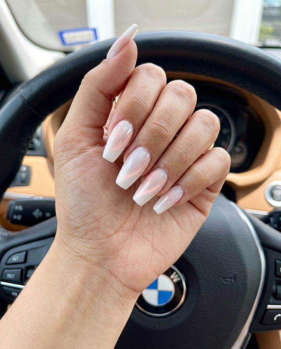 Mystic Milky Cat-Eye Nails 2026 Milky white nails with a shifting cat-eye effect for summer wedding nails 2026. Glamorous and mystical.
