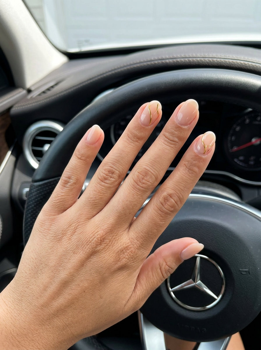 Chic Nude Line Art Wedding Nails 2026 Chic bridal nails 2026: sheer nude with minimalist black or gold fine line art for a modern wedding look.