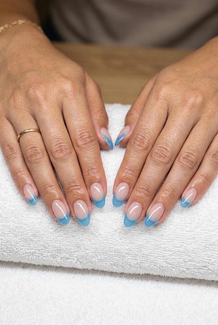 Sky Blue Jelly French Tips 2026 | Refreshing Vacation Style Jelly sky blue French tip almond nails for vacation, daily wear. Trending summer nails 2026.