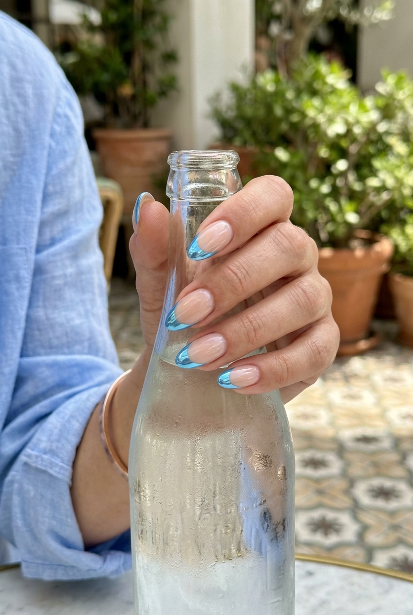 Sky Blue Chrome French Fade Nails 2026: Chic Summer Vacation Trending summer nails 2026: Sky blue chrome French fade on oval nails for vacation and chic summer events.