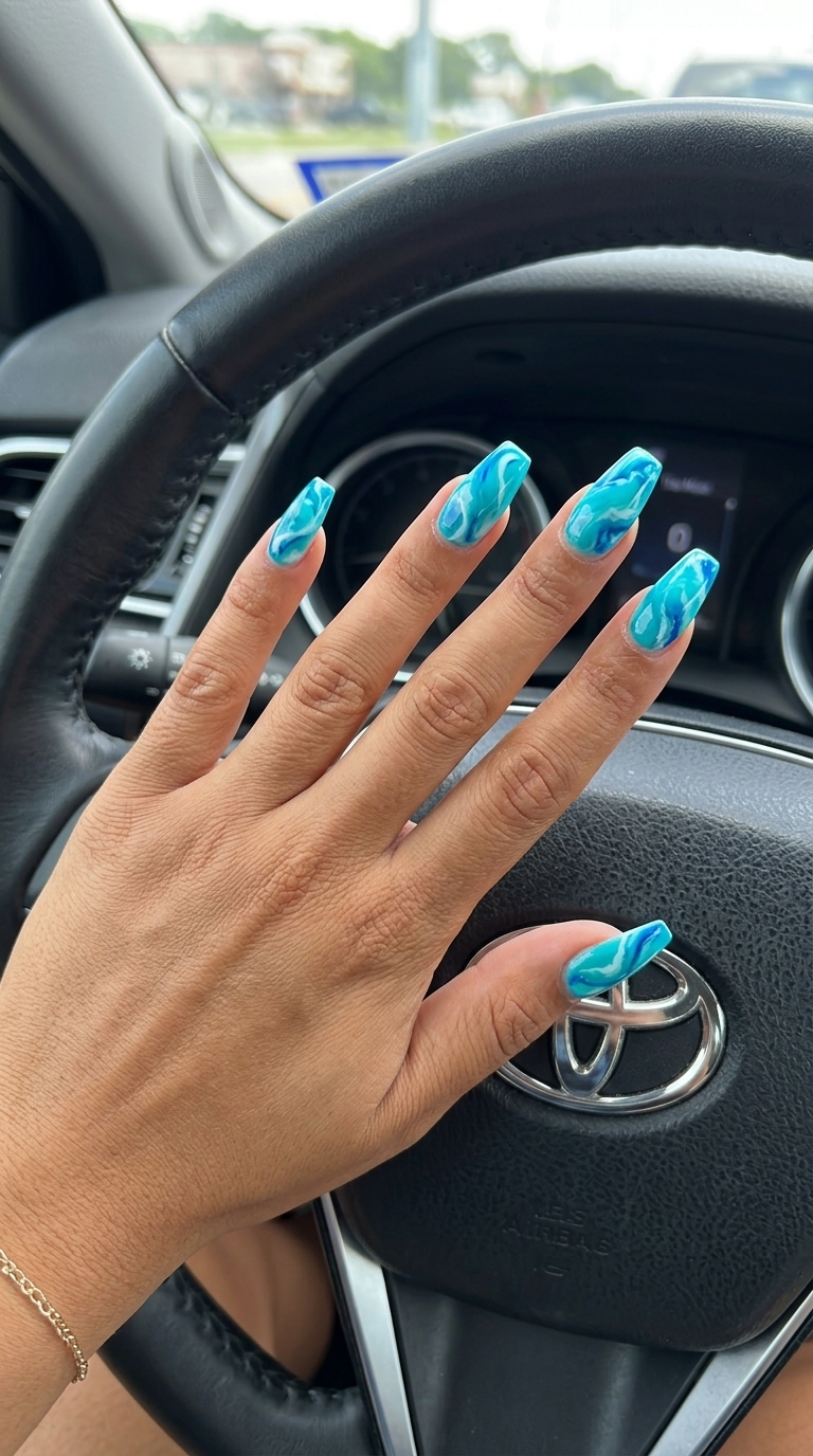Glam Nails 2026: Lagoon Marble Sophisticated tropical nail designs 2026: Lagoon Marble with vivid turquoise and white.