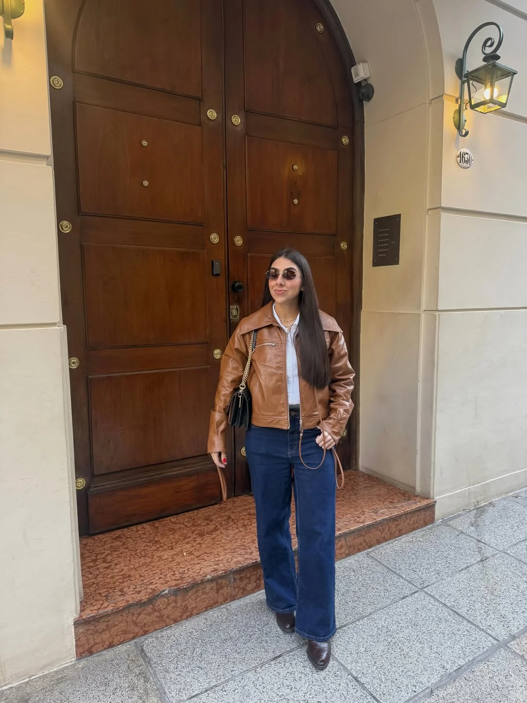 simple fall outfits 2026 Cognac Leather Jacket With Dark Denim Classic