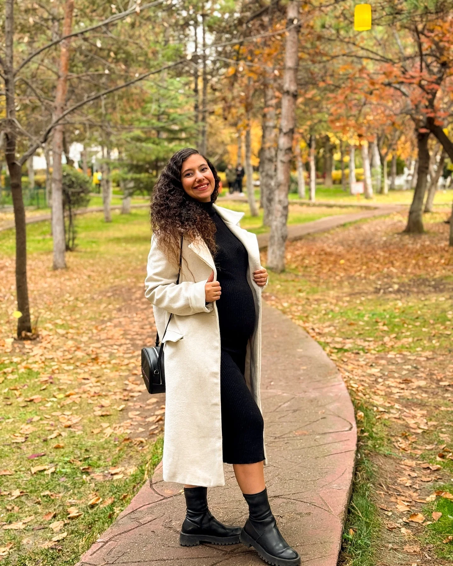 fall pregnancy outfits 2026 Long Coat And Ribbed Dress For Crisp Fall Weather