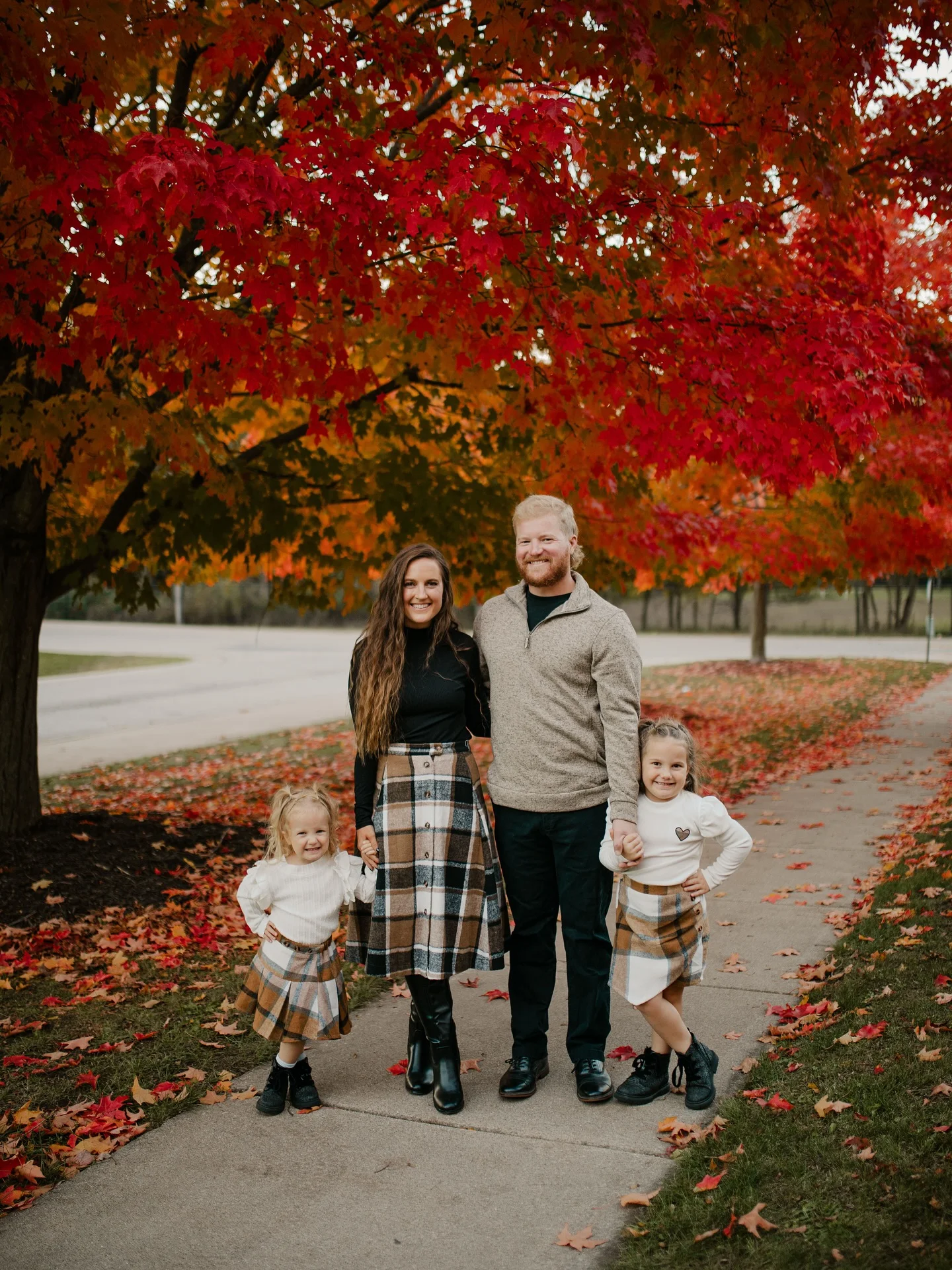 fall family picture outfits 2026 Coordinated Plaid Skirts And Neutral Knitwear