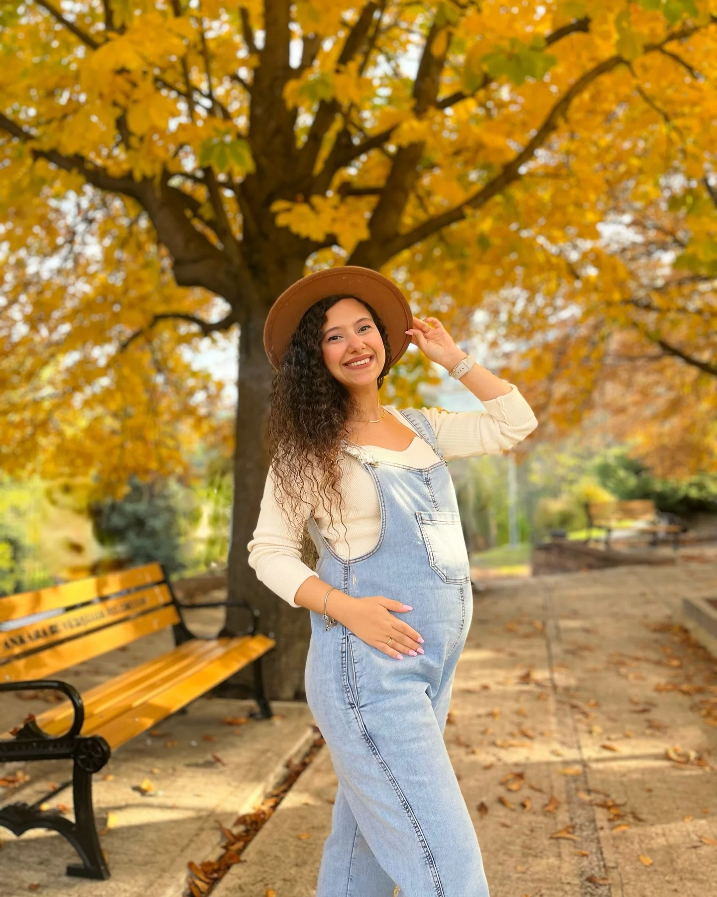 fall pregnancy outfits 2026 Soft Denim Overalls With A Cozy Autumn Hat