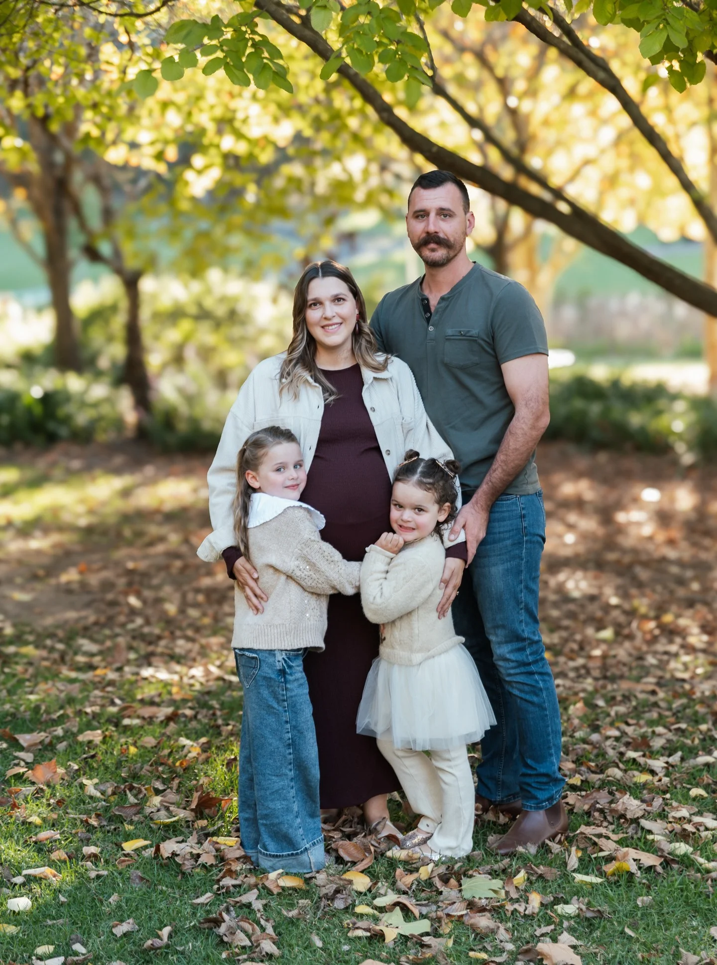 fall family picture outfits 2026 Cozy Burgundy And Cream Layers For A Growing Family