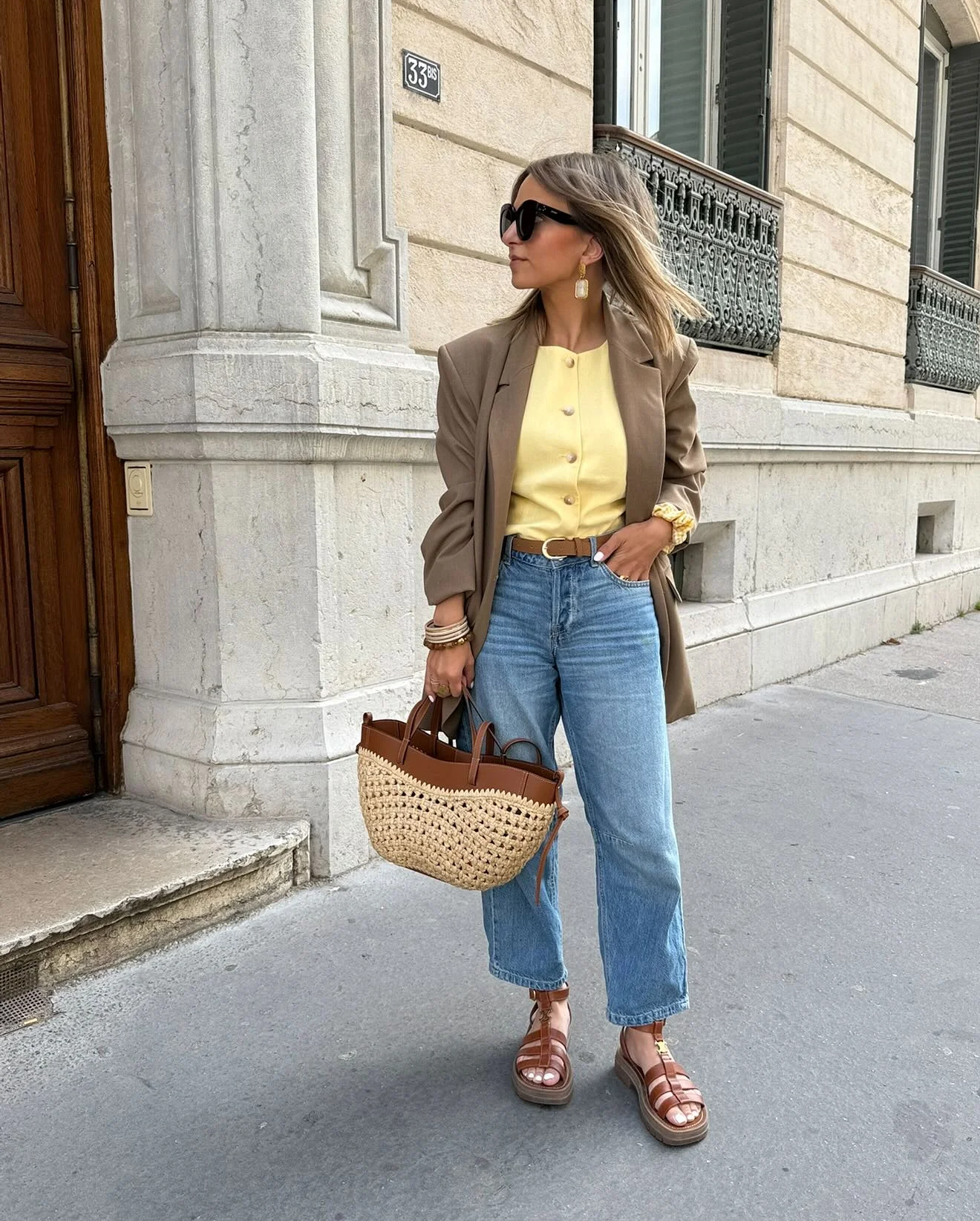 early fall outfits 2026 Soft Yellow Blouse With Relaxed Denim And Raffia Bag