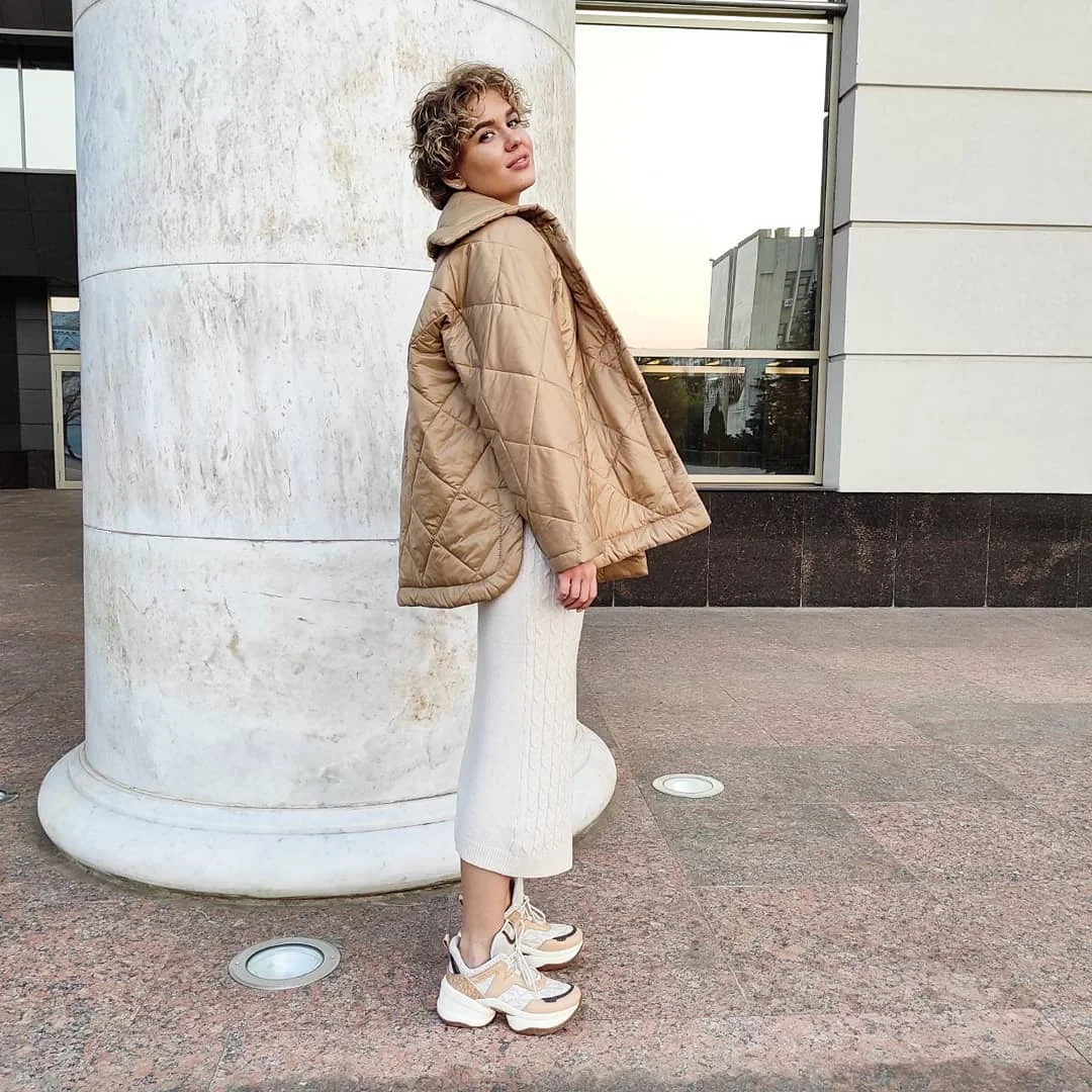 knit skirt outfits fall 2026 Cream Cable Knit Skirt With A Relaxed Quilted Jacket