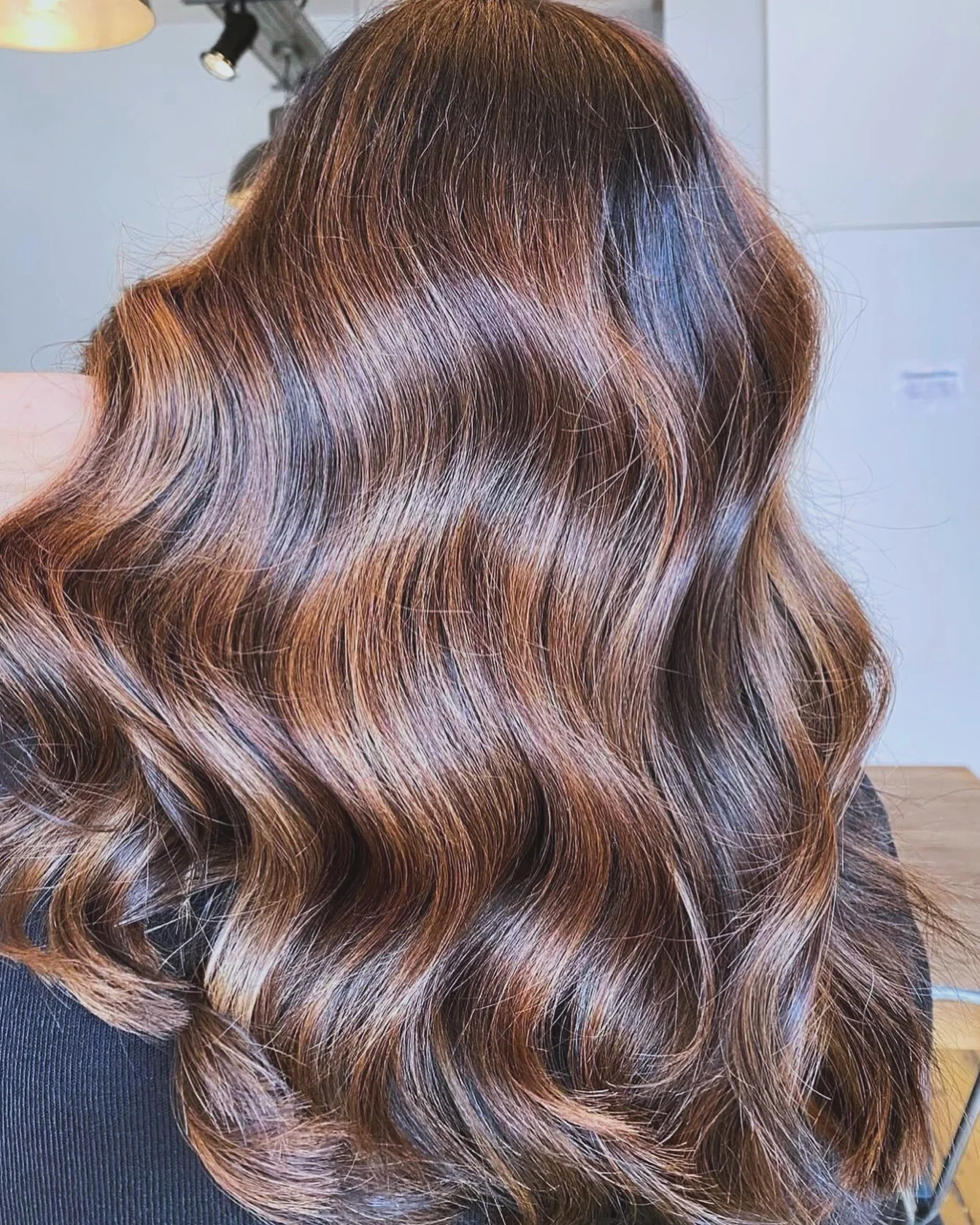 chestnut brown hair color Glossy Chocolate Chestnut Waves With Seamless Highlights